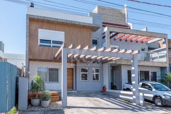 Casa com 136m², 3 dormitórios, 1 suíte, 2 vagas no bairro Hípica em Porto Alegre para Comprar