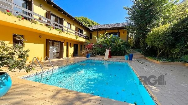 Casa Condominio em Porto Alegre, no bairro Cavalhada, com 4 dormitório(s), e 4 banheiros, à venda.