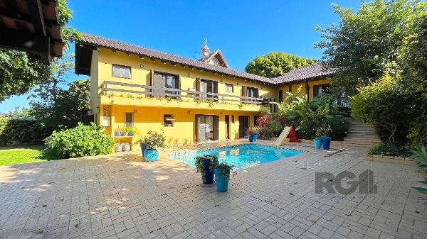 Casa Condominio em Porto Alegre, no bairro Cavalhada, com 4 dormitório(s), e 4 banheiros, à venda.