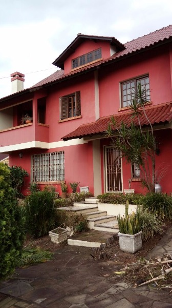 Casa com 320m², 3 dormitórios, 1 suíte, 3 vagas no bairro Altos Do Ipê em Porto Alegre para Comprar