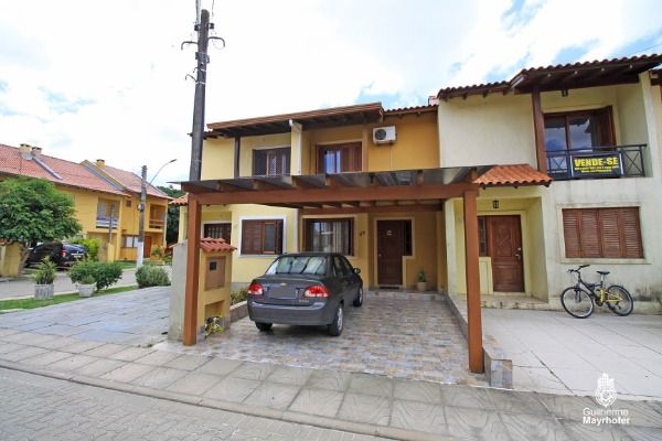 Casa Condominio com 72m², 2 dormitórios, 2 vagas no bairro Hípica em Porto Alegre para Comprar