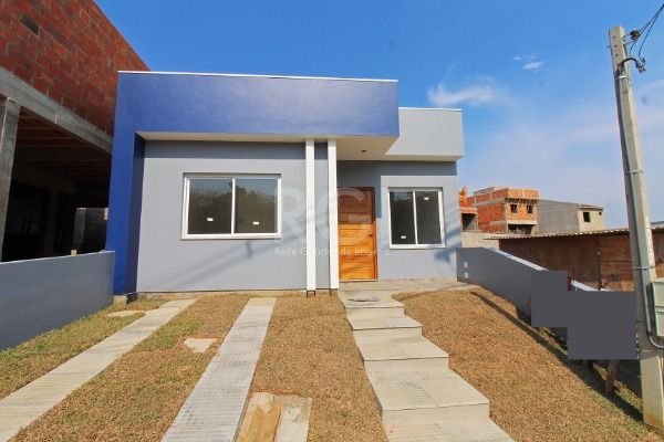 Casa com 75m², 3 dormitórios, 1 suíte, 2 vagas no bairro Lomba do Pinheiro em Porto Alegre para Comprar