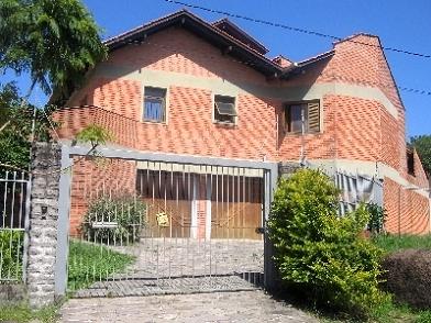 Casa com 600m², 4 dormitórios, 4 suítes, 2 vagas no bairro Jardim Isabel em Porto Alegre para Comprar